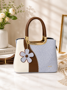 small handbag with a beautiful flower accessory