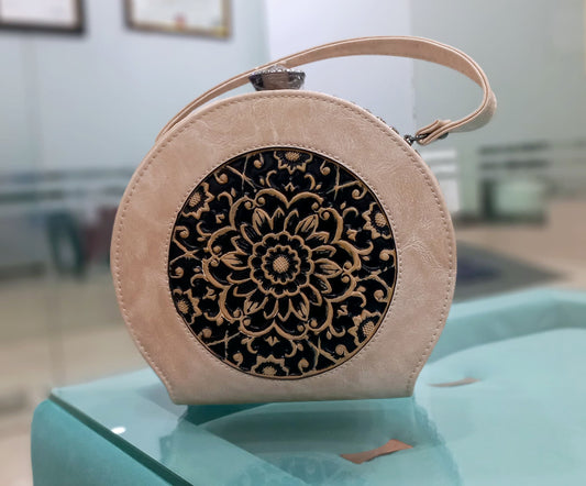 Round beige colored bag