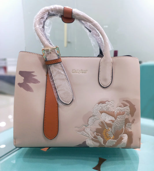 Trendy women handbag with extra shoulder strap