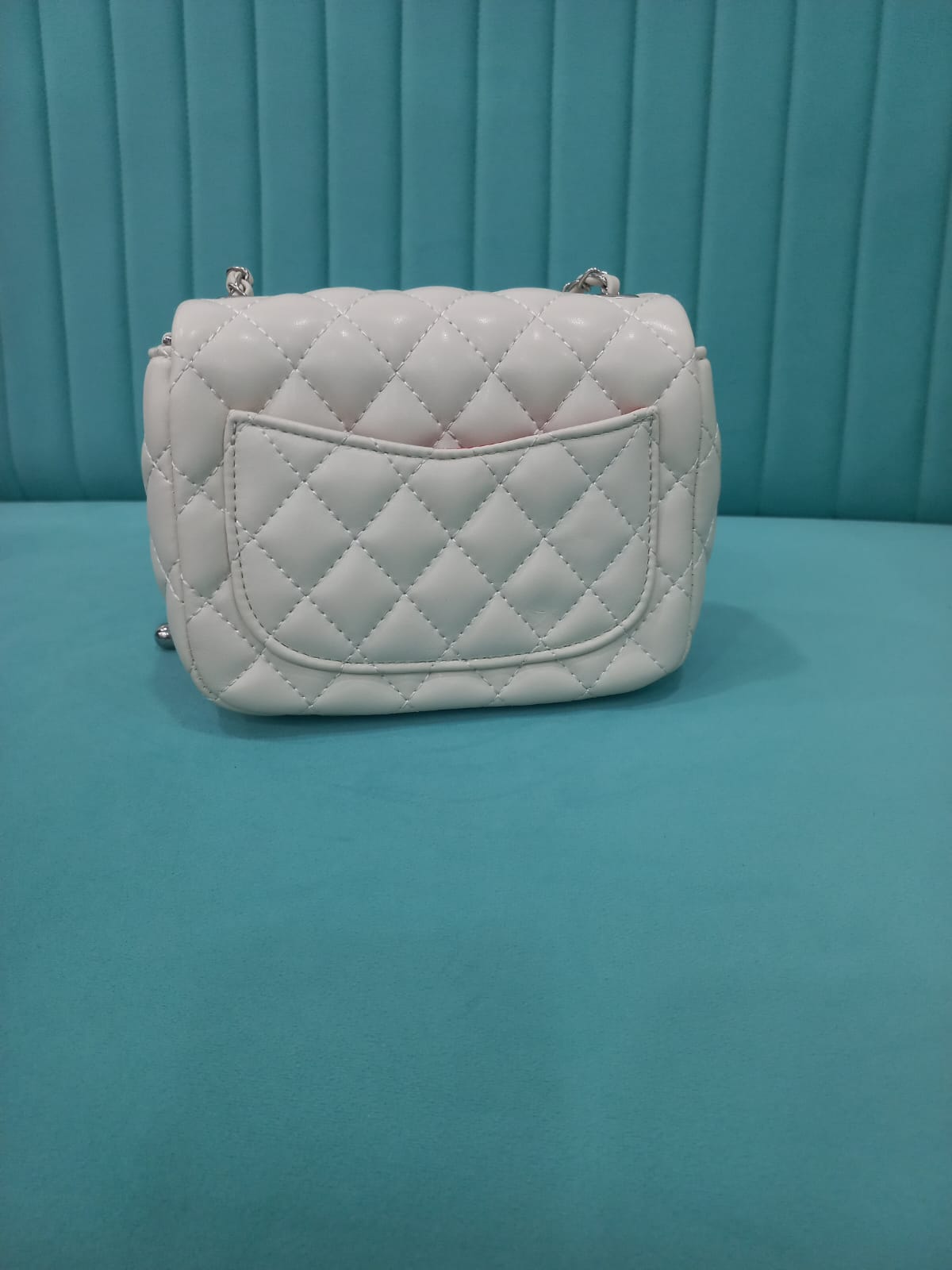 White handbag with butterfly design
